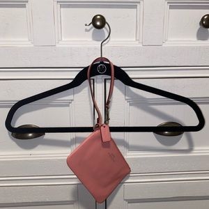 Peach coach wristlet